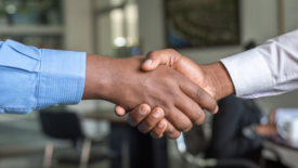 businessmen shaking hands up close